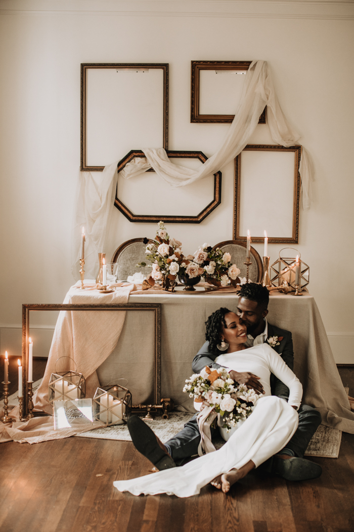 couple embracing in front of tablescape