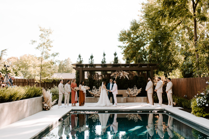 poolside backyard wedding ceremony